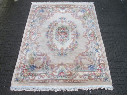 Lot 658 - A large pale Chinese carpet 330cm x 242cm