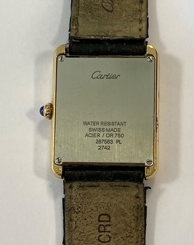 Lot 235 - Cartier - A Swiss 18ct gold and stainless steel 'Tank Solo' wristwatch