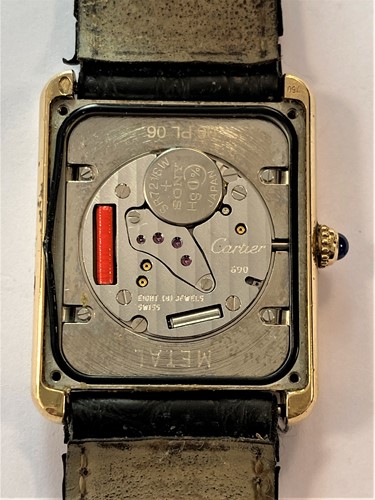 Lot 235 - Cartier - A Swiss 18ct gold and stainless steel 'Tank Solo' wristwatch