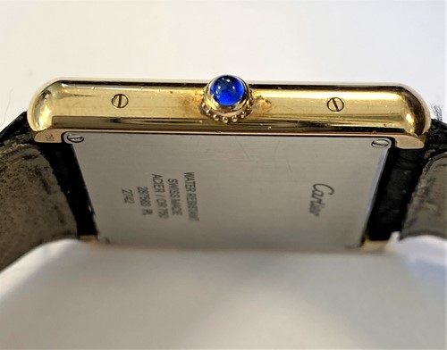 Lot 235 - Cartier - A Swiss 18ct gold and stainless steel 'Tank Solo' wristwatch