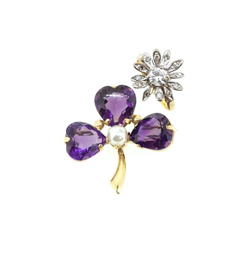 Lot 30 - A diamond cluster ring together with an amethyst brooch