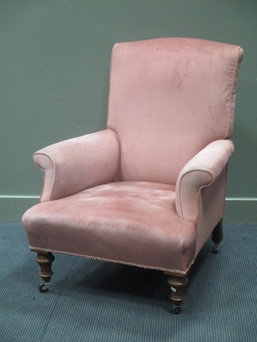 Lot 403 - An Edwardian pink upholstered wing armchair on...