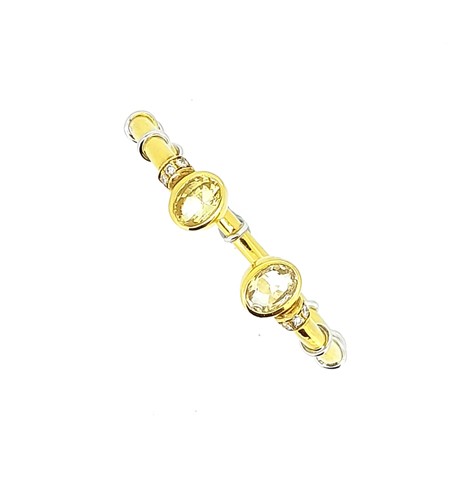 Lot 82 - A yellow sapphire and diamond torc style hinged bangle