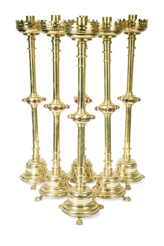 Lot 436 - A set of six early 20th century gothic revival brass candlesticks