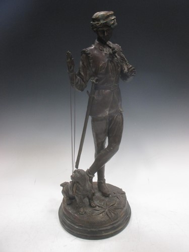 Lot 41 - A 20th century bronze of a boy with his dog,...