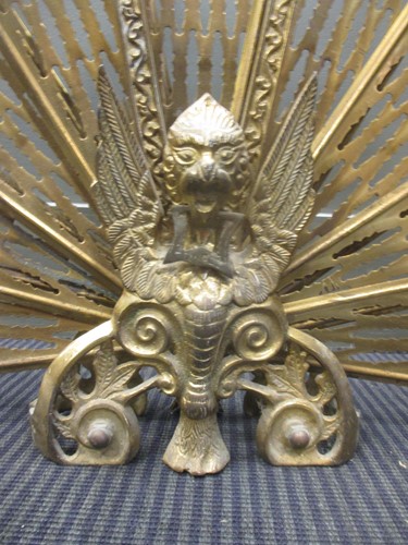 Lot 572 - A brass peacock tail fire screen, 63cm high