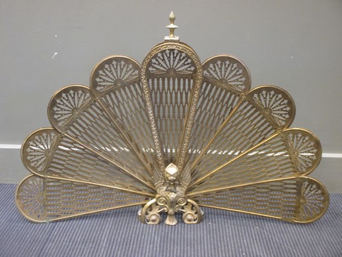 Lot 572 - A brass peacock tail fire screen, 63cm high