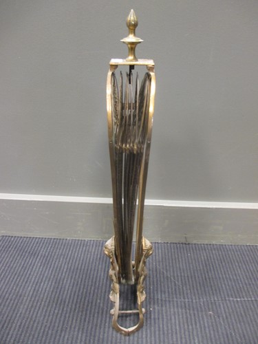 Lot 572 - A brass peacock tail fire screen, 63cm high