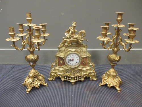 Lot 40 - A brass clock garniture, the clock 41cm high,...