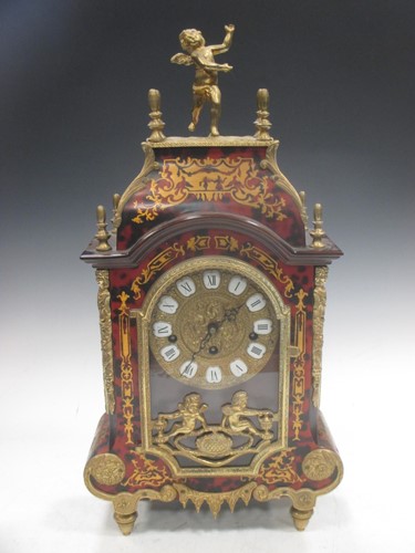 Lot 43 - A Boulle mantel clock, surmounted by a cherub,...