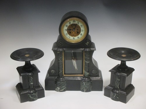 Lot 55 - A late Victorian black marble clock garniture,...