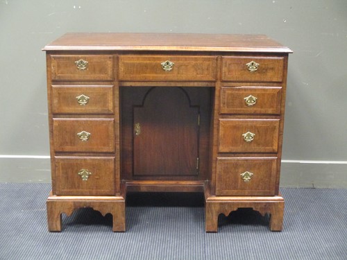 Lot 444 - An early 18th century style walnut and feather...