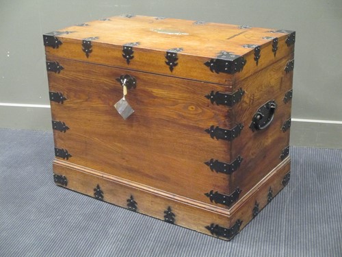 Lot 409 - An oak and iron bound silver chest with side...