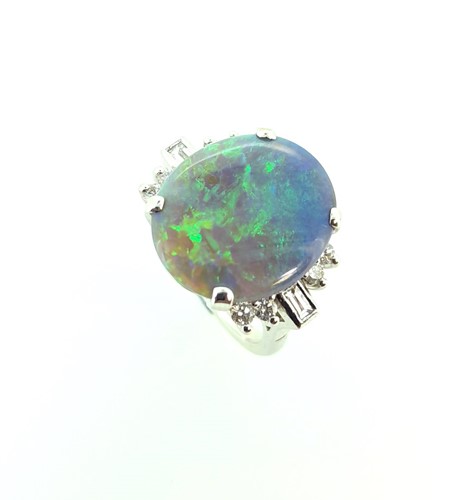 Lot 37 - A black opal and diamond cluster ring