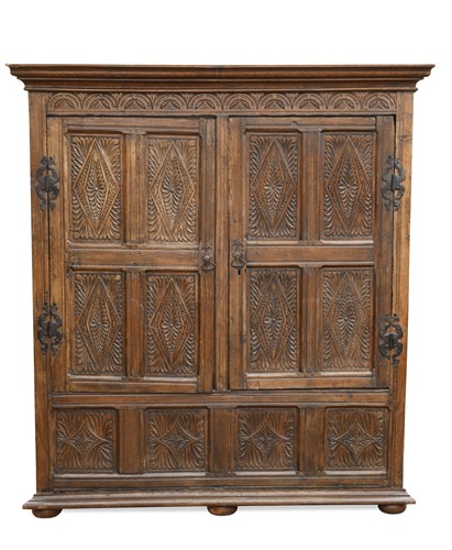 Lot 218 - A carved oak panelled livery cupboard, 19th century