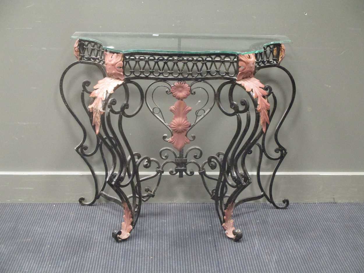 Lot 431 - A Wrought iron console with glass top, 76 x...