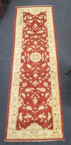 Lot 589 - A 20th century Caucasian red ground runner 248...