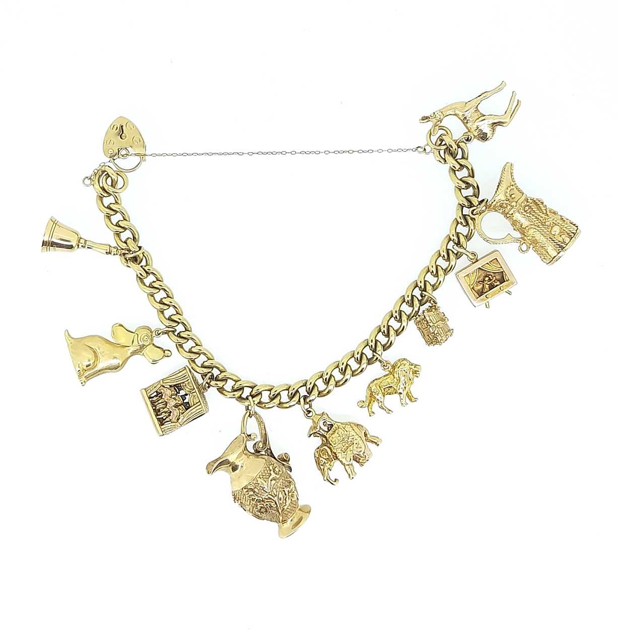 Lot 11 - A 9ct gold charm bracelet with many hallmarked charms