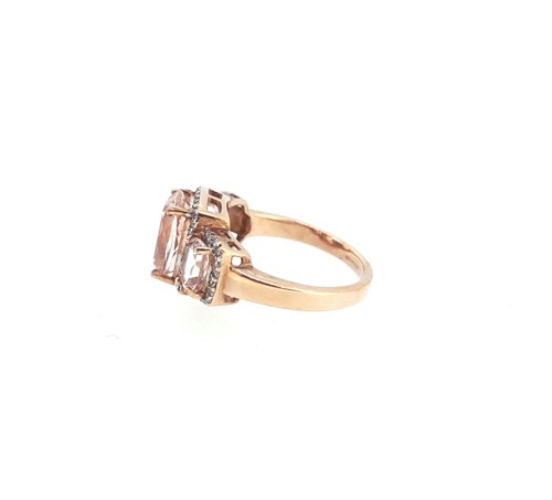 Lot 23 - Two gold dress rings, one set with morganite, the other with peridot