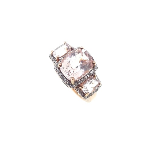 Lot 23 - Two gold dress rings, one set with morganite, the other with peridot