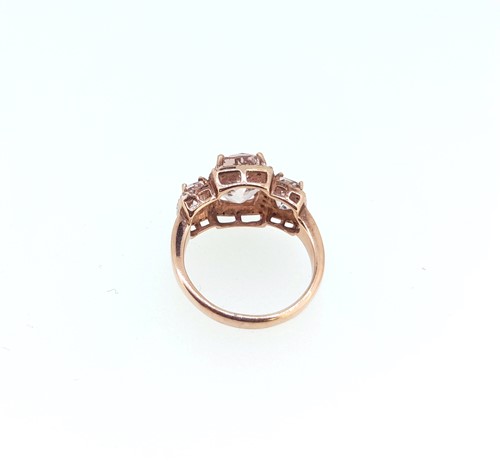 Lot 23 - Two gold dress rings, one set with morganite, the other with peridot