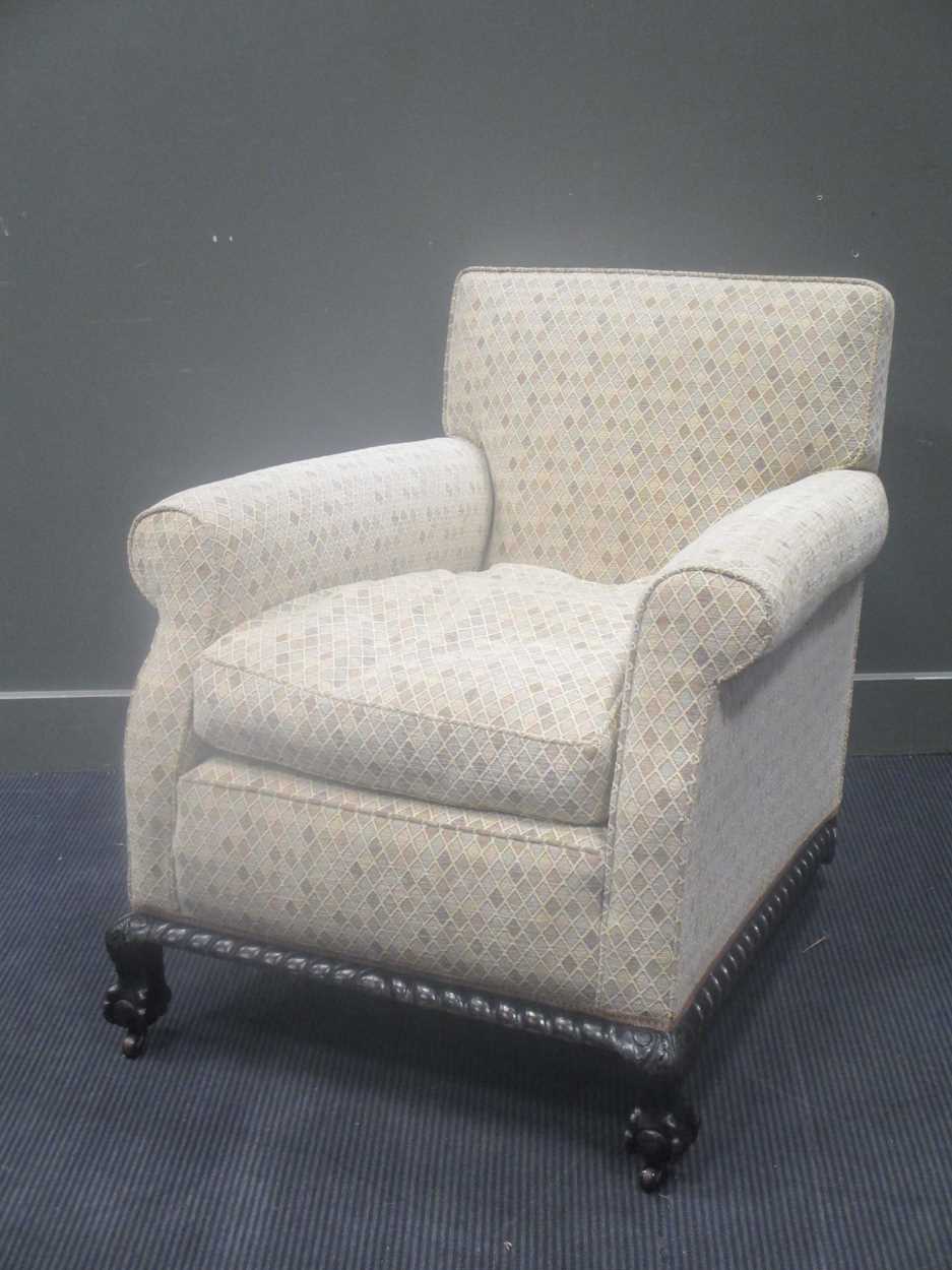Lot 537 - Circa 1900 A Howard style armchair on ball in...
