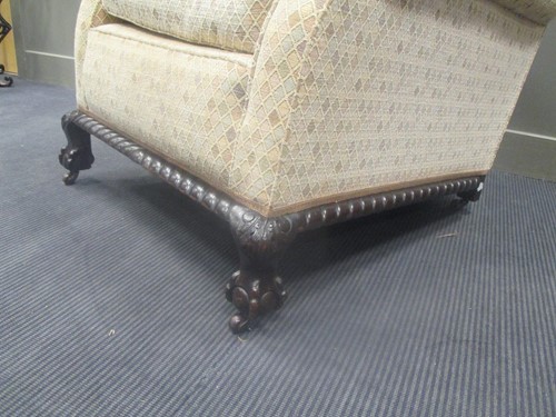 Lot 537 - Circa 1900 A Howard style armchair on ball in...