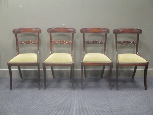 Lot 547 - A set of four Regency mahogany sabre leg...