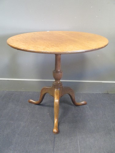 Lot 539 - A George III mahogany circular tilt top table...