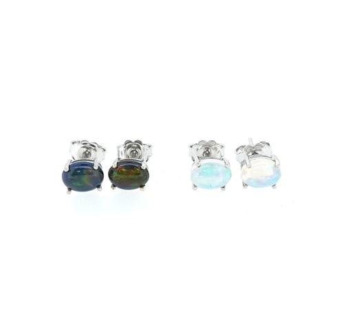 Lot 39 - A pair of black opal and a pair of white opal ear studs