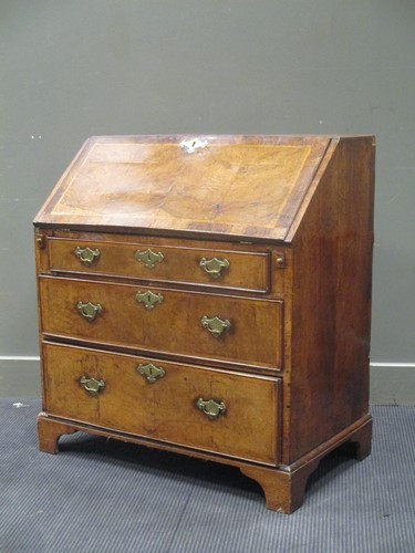 Lot 446 - An 18th century walnut and feather banded...