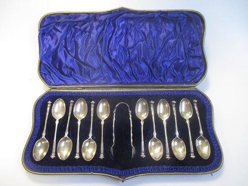 Lot 172 - A cased set of 12 silver teaspoons and tongs,...