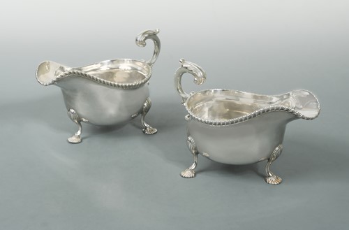 Lot 401 - A pair of George V silver oversized sauceboats