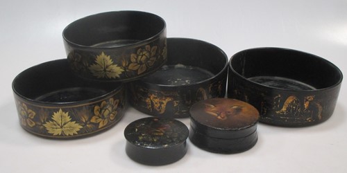 Lot 140 - Two pairs of black lacquer Regency coasters...