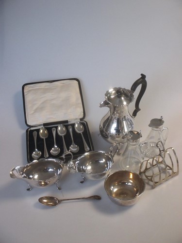 Lot 178 - Two silver sauce boats, a silver toast rack, a...