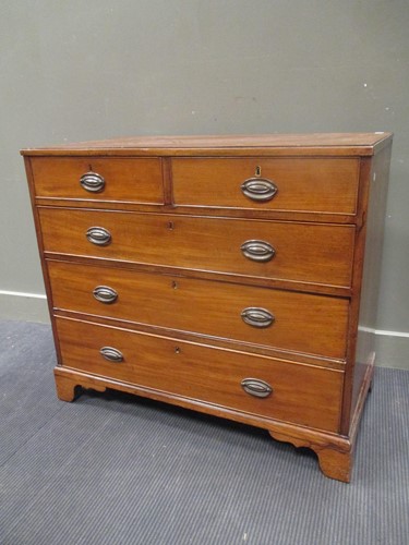 Lot 501 - A late George III mahogany chest of two small...