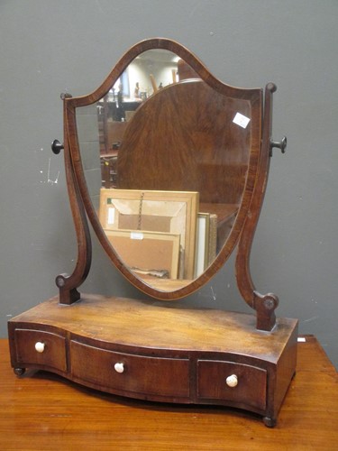 Lot 432 - A George III mahogany shield shaped dressing...