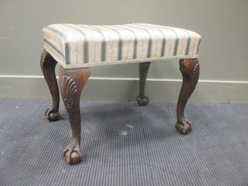 Lot 333 - A George II style carved rectangular upholstered stool, 20th century
