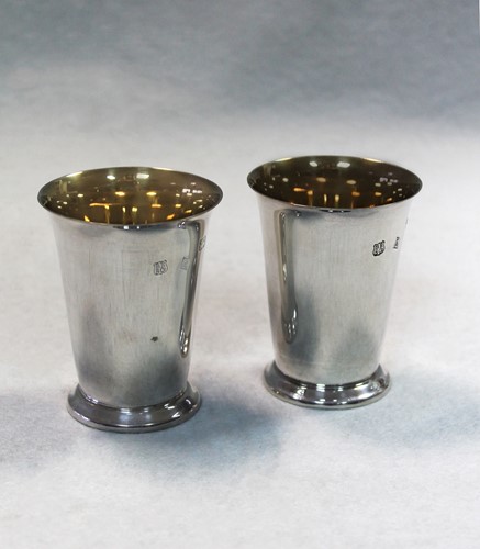 Lot 411 - A pair of 20th century silver beakers