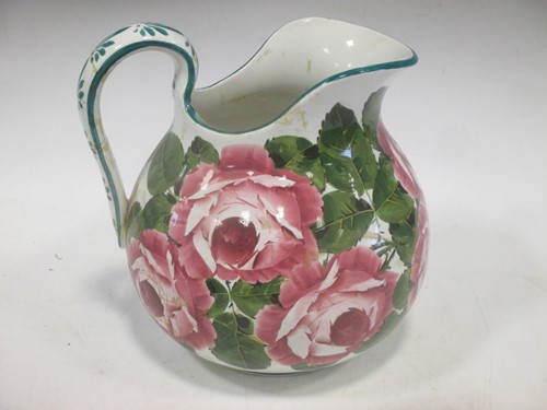 Lot 68 - A Wemyss jug with floral decoration 23cm high