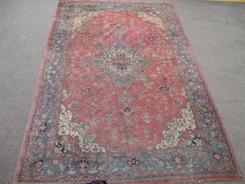 Lot 414 - A pink ground 'Turkey' carpet, 549 x 362cm