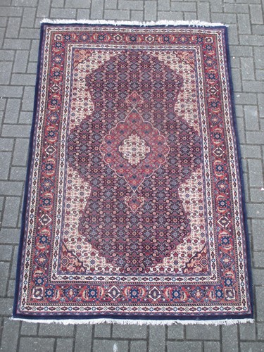 Lot 595 - A Tabriz style rug 214 x 137cm