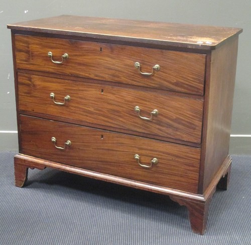 Lot 355 - A Georgian mahogany chest of three long...