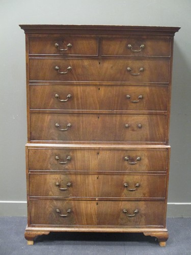 Lot 519 - A George III chest on chest comprising of two...