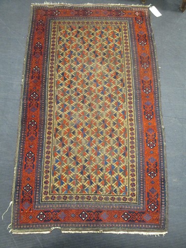 Lot 593 - A Beluchi rug 190 x 108cm