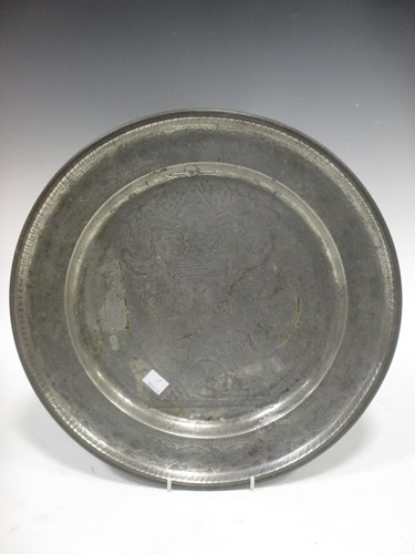 Lot 32 - A pewter dish with incised decoration, bearing...