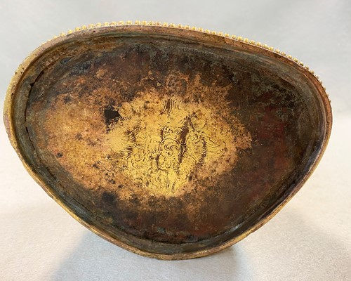 Lot 380 - A Tibetan or Mongolian gilt bronze lama