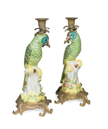 Lot 434 - A pair of gilt metal mounted porcelain parrot candlesticks, 20th century
