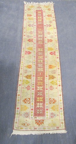 Lot 598 - An attractive pale-ground Caucasian style runner