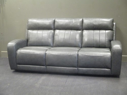 Lot 494 - A modern grey leather three seater sofa with...